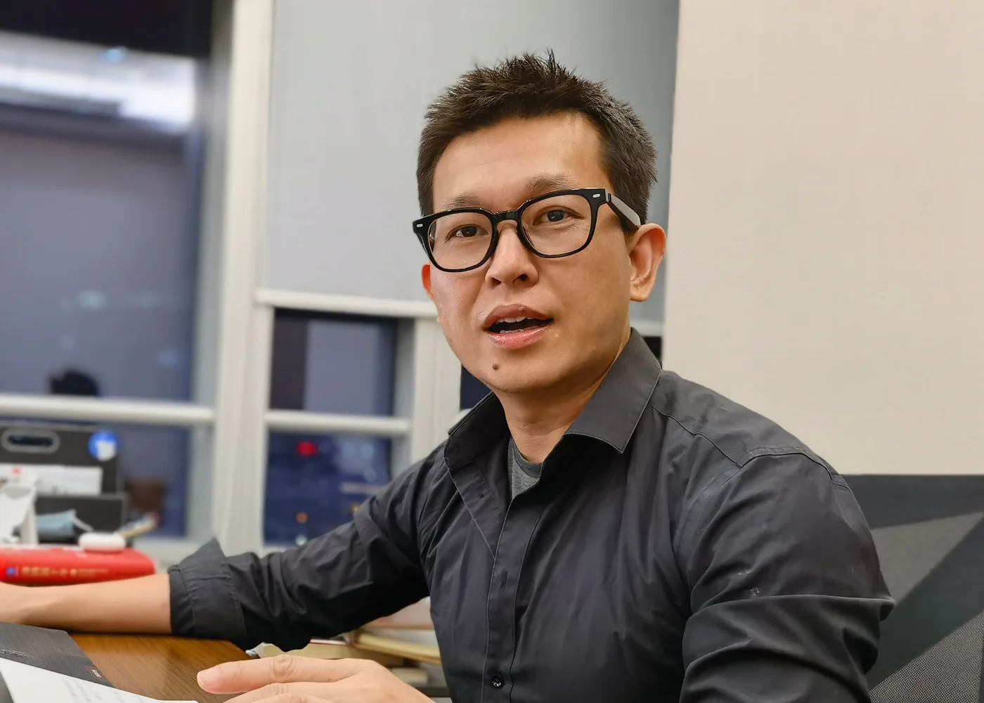 Peter Lin working at his desk